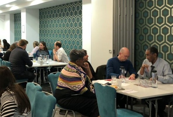 People discuss ideas around tables at the BFSS Grant Holders' Workshop 2022